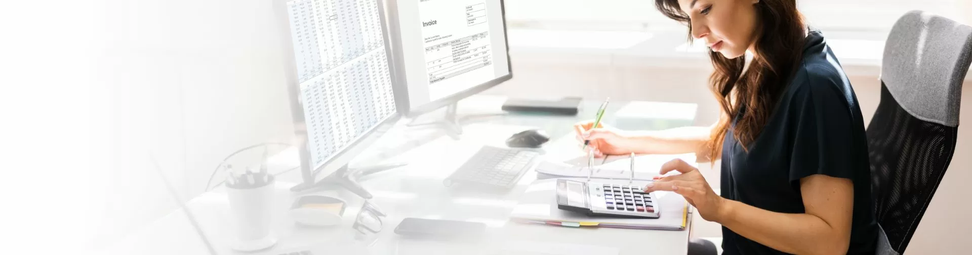 Lady at the desk on calculator